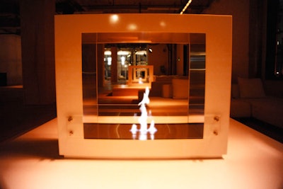 Six free-standing, eco-friendly white fireplaces were centered atop custom-built platforms.