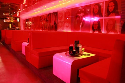 Red leather booths and prints of Andy Warhol's famous art works line the wall inside the dance club.