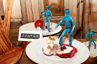 For the dessert course, an inverted blueberry pie, shaped like the moon Pandora from Avatar, sits next to a candy sculpture of the alien creatures depicted in the film.
