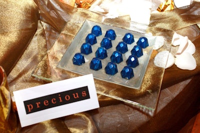 The second set of petit fours, based on Precious, draw inspiration from the film's source material and author Sapphire, who executive pastry chef David Carmichael salutes with chocolate truffles colored and shaped like her namesake stone.