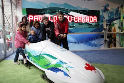 Photo opportunities on site include Olympic torches from different winter games, sports equipment, and a replica of the team Canada bobsled.