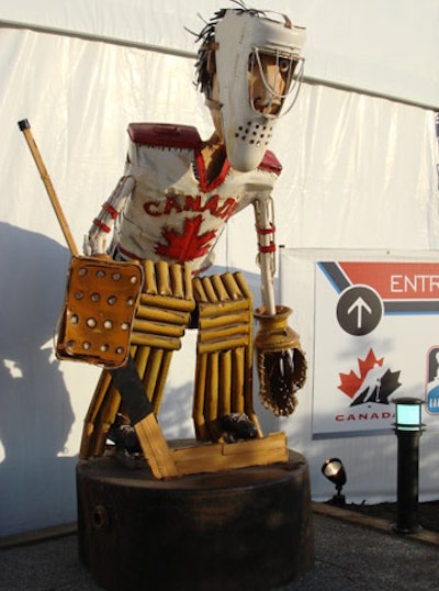 Sculptures on display at Molson Canadian Hockey House include a hockey player, which stands at the entrance to the venue, and multiple oversize hockey masks.