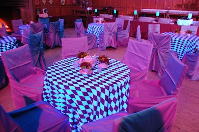 Checkered linens and teapots topped tables for a mad tea party in the Great Hall at Hart House.