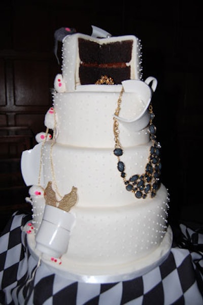 Teacups, saucers, and jewelry adorned a tiered cake that sat on display in the Great Hall.