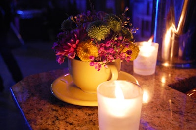 Teacups filled with flowers topped the bar where servers offered cocktails made with TAG Vodka.