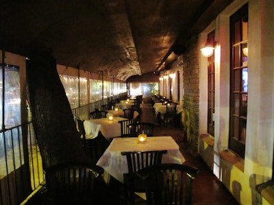 The covered front patio can seat 50 for a private party.
