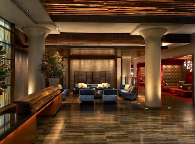 Inspired by the city's parks, Ink48's design from David Rockwell and Carlos Zapata includes upholstered panels of graphic floral patterns, walnut wood surfaces, and walls decorated with sea-colored glass.