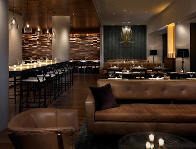 At the center of the Rockwell Group-designed restaurant is a 16-foot-long communal table.