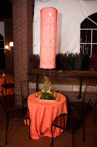 Moroccan lamps with mirrored discs hung over cocktail tables on the enclosed terrace.