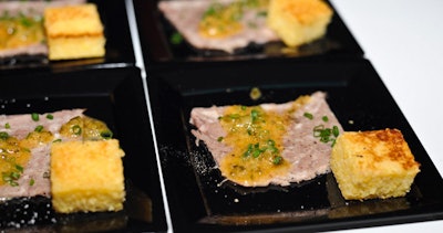 Los Angeles's Animal Restaurant served head cheese and fried cornbread with bread and butter pickle vinaigrette.