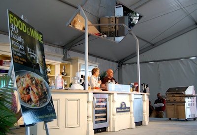 Chef Michael Symon hosted a food demonstration in one of KitchenAide's two tents at the Grand Tasting Village on Saturday afternoon.