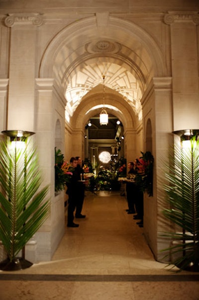 To set the scene, Galen Lee and Bernadette Morrell added monstera leaves, birds of paradise, and 1930s-style torcheres to the entrance hall of the Frick Collection.