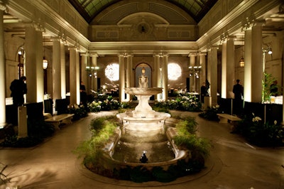 In the garden court, the event's central space, Lee and Morrell used Lucite, orchids, and palm leaves to hint at the motif.