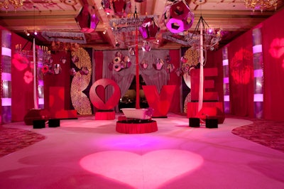 Oversize letters spelling out 'love' contributed to the event's red and pink decor.