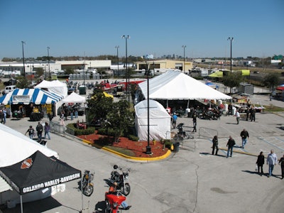 Bike apparel and accessory vendors and local barbecue caterers set up tents in the dealership's parking lot for the week.
