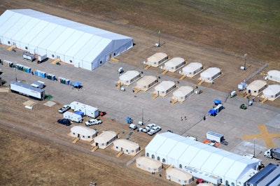 Premier Tenting Solutions and Event Rentals set up tents housing 500 people each in Beaumont, Texas, in September 2008, following Hurricane Ike.