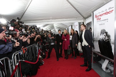 Pattinson spent more than half an hour making his way down the red carpet, giving interviews and posing for the nearly 100 media representatives present.