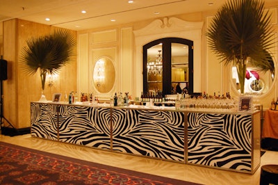 Tall palms topped the zebra-print bar for the jungle-themed cocktail reception.