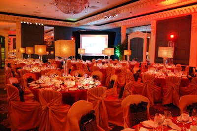 Paprika coloured linens and gold chair covers created a warm glow in the dining room.