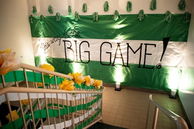 Homecoming essentials like crepe paper in St. Patrick's school colors, pompoms, and tissue paper flowers livened up the stairway leading to the gym.