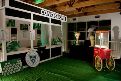 A concession stand selling St. Patrick's-branded stadium blankets and pennants stood outside the gym's entrance, next to a display of decorative trophies and a popcorn stand.