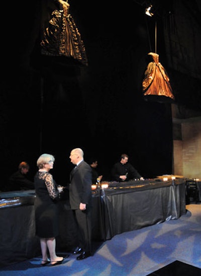 The cocktail area adjacent to the dining room showcased ball gowns used in the ballet's production of Black and White, which served as the evening's decor inspiration.