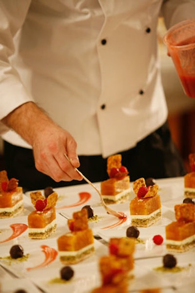 A Ridgewells chef prepared a dessert of peaches, vanilla cream, and almond cake in an amaretto peach coulis.