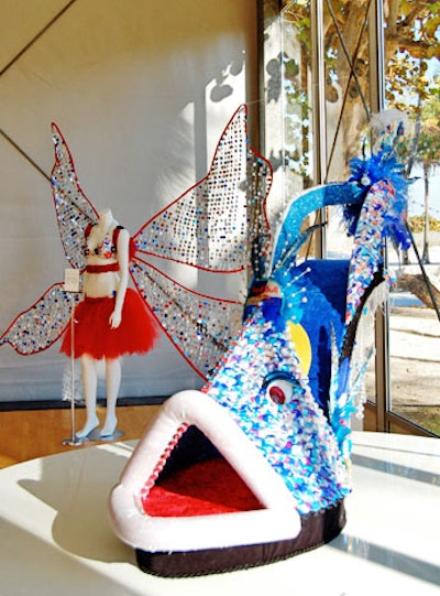 Costume, sculpture, and interior designer Robert Tabor's 'Fierce Fish Stilletto' and fashion designer Monica Eddleman's 'Energized by Wings' sculptures lined the wall of the tent's main entrance.