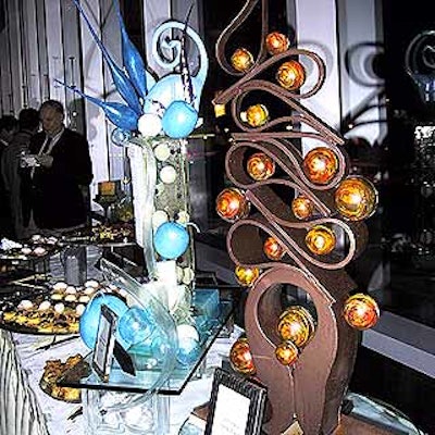 The dessert tables in the hall outside the ballrooms were decorated with sugar and chocolate sculptures.