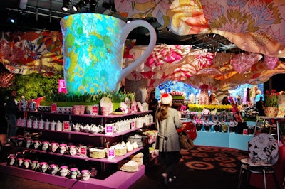 To complement the line's pretty floral patterns, David Stark filled the temporary store with 12,000 live flowers, colorful projections on oversize props, and images from the ad campaign.