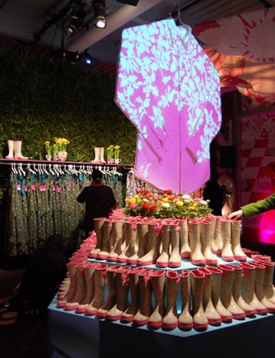 Moving projections of flowers shone on large white props, including an oversize shirt.