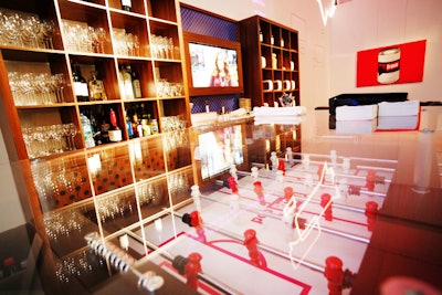 The pop area of the event included a foosball table bar, and bookshelves that housed trays of pizza.
