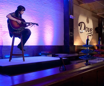 A guitarist played acoustic covers of popular songs on a platform behind the bar.