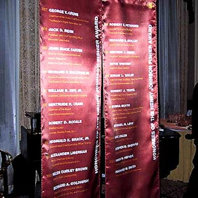Red fabric banners were printed with the names of past Henry Johnson Fisher award recipients.