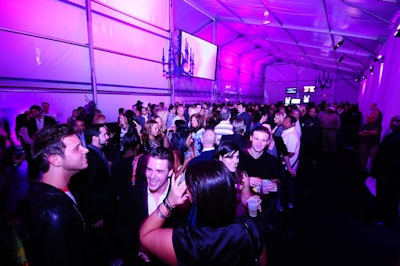 Guests mingled in the long hallway and lounge area outside the runway space prior to the show.