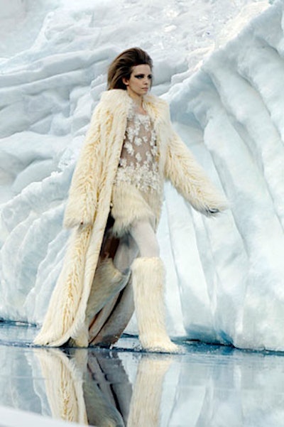 Models in faux fur boots and coats splashed through the pool of water created by the melting ice.