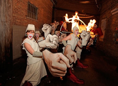 As guests arrived, performers wearing giant fists cheered them on and shouted 'ooh' and 'aah.'