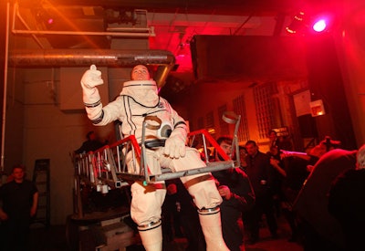 A performer dressed as an astronaut serenaded the crowd.