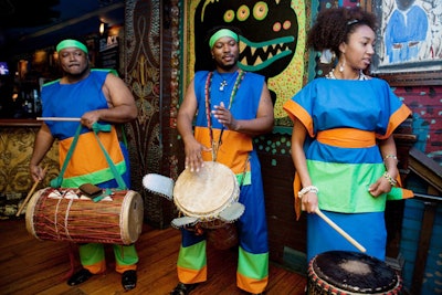 Brightly attired drummers played along the stairwell leading to the main performance space.