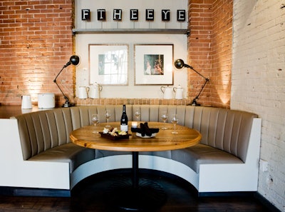 The café, at the entrance to the restaurant, seats 48 and houses four curved banquettes.