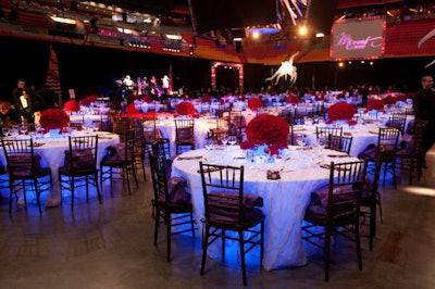 Event producers at Wow Factor Marketing Group used black drape to separate the dinner area on the arena floor from the venue's built-in seats.