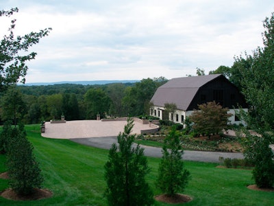 The property's 6,000-square-foot trilevel barn has an elaborate audiovisual system and 5,000 square feet of landscaped terrace.