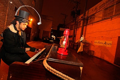 A spotlit pianist serenaded guests with personalized songs.