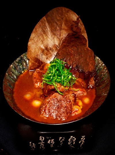 Signature dishes include cajun salmon; tiradito with habanero lime sorbet; duck leg with kabocha ravioli; and hamachi poke style.