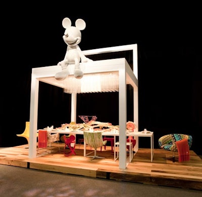 Disney's sleek setting included colorful chairs from the Walt Disney Signature furniture collection as well as a giant Mickey Mouse sculpture atop the structure.