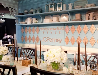 J.C. Penney's table, by Shiraz Events, Atomic Design, and Sara Costello, used items from its Cindy Crawford home collection in a traditional dining room look. The design team also spelled out the company's name in pennies.