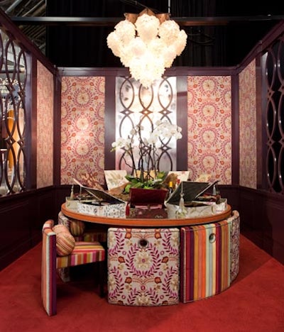 Kravet's space had colorful upholstered chairs that fit around the dining table like a puzzle when pushed in. Atop each setting was a fabric box filled with dishes and a set of chopsticks.