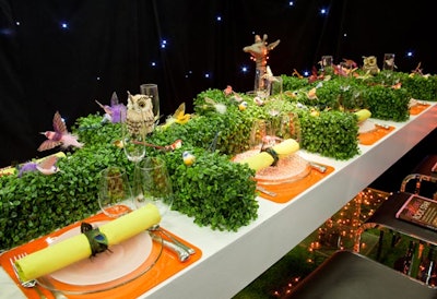 Jes Gordon's whimsical bar-height table included a faux hedge divider topped with birds and animals.