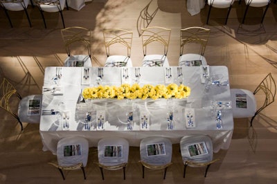 Tables were decked with white linens and low centerpieces filled with tightly packed daffodils.