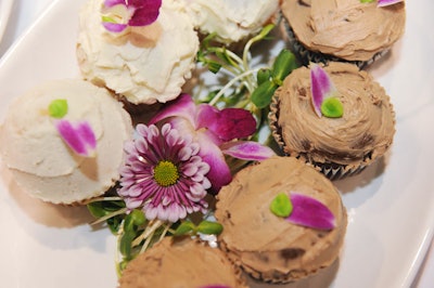 Cupcakes topped with flowers were on offer for party guests.
